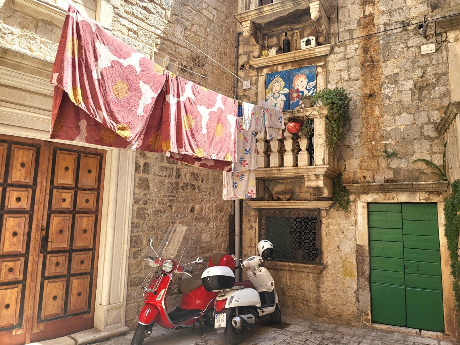Historic Kala Street in Trogir Old Town with traditional stone architecture